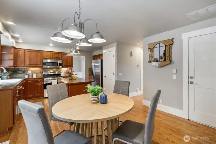 Another view of the kitchen, kitchen eating area... pantry behind kitchen door.