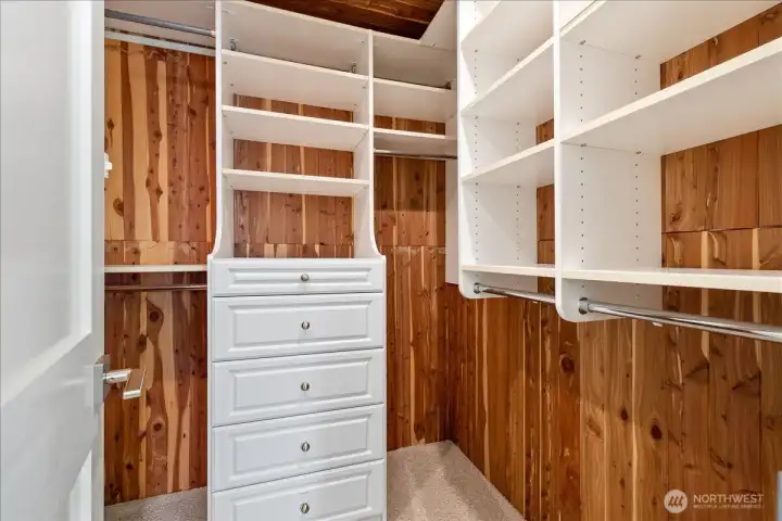Cedar lined primary walk-in closet with built-ins.