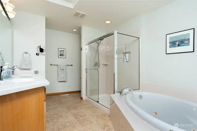 Side A- Private 5-piece bath in primary suite includes jetted tub