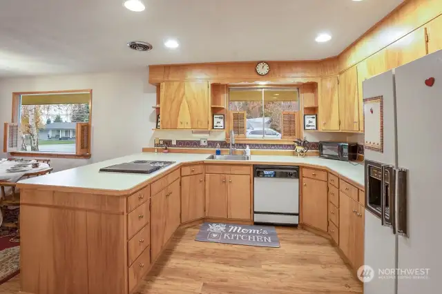 Large kitchen with original birch cabinets