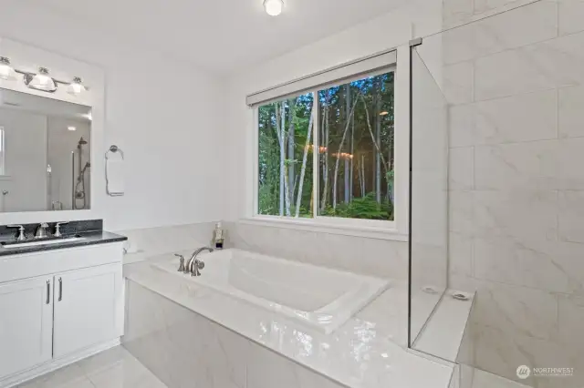 Primary ensuite bathroom with soaking tub & low step shower.