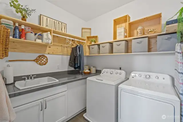 Utility room is upstairs & has deep laundry sink.