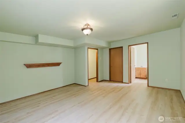 Lower level bonus room with half bath and utilities.