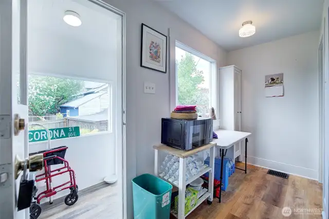 Small back enclosed porch that leads to the back yard.