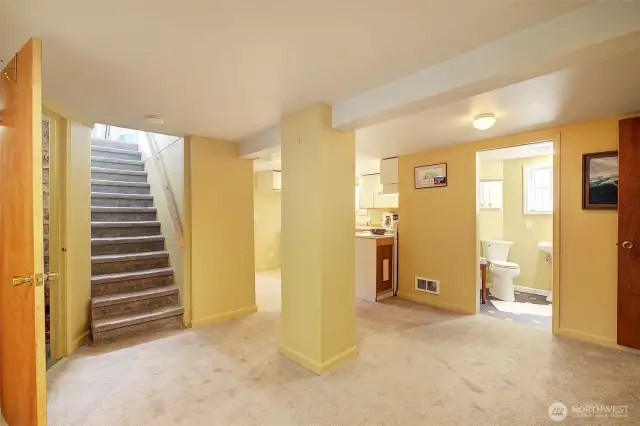 Stairs from the main level to the fully finished lower level.
