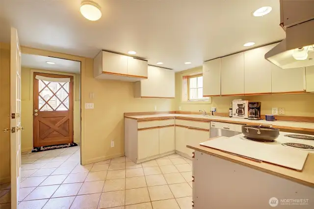 Lower level kitchen and door to the back yard.