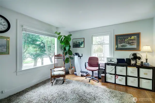 Large window in the living room looks over the front yard.