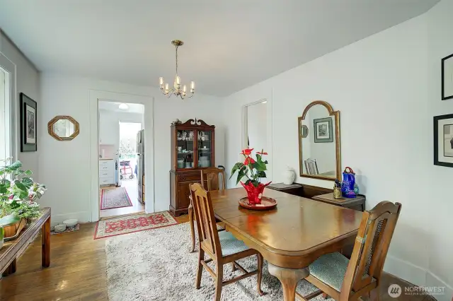 Dining room with large window overlooking the side yard.