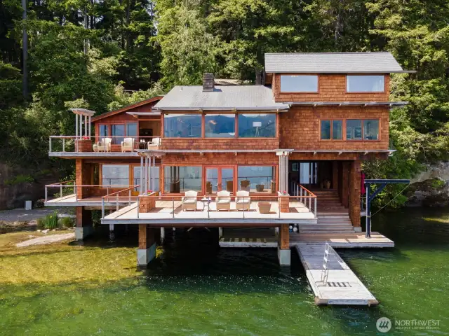 This home is notable as it is a rare home that is built into the rock and propels out over the lake.