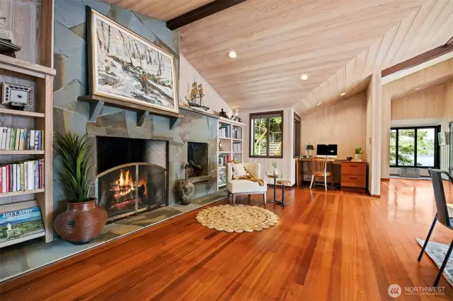 This fireplace is a pinnacle part of the home and such a grand feature. There are built-in bookcases on either side and the perfect desk alcove.