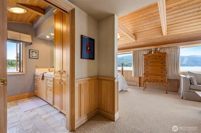 The upper bedroom suite is very spacious and has views from all rooms, including the bathroom.
