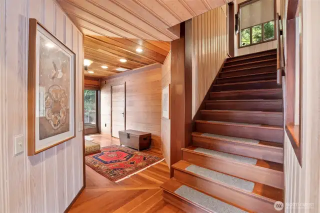 The lake level is also finished with wood walls and floors like that of the upper floors. The closed door is a 3/4 bath and there is a door that opens to the deck and a built-in wine rack, as well.