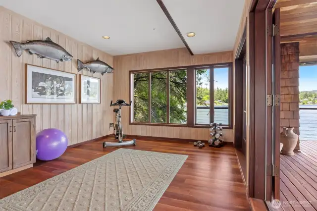 There is another room on the lower level that could be a 4th bedroom or office, but is currently used as an exercise room. This room also opens to the wraparound deck with French doors.