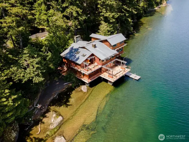 An aerial view of this exquisite home and beach on Lake Whatcom. This roof looks like slate but it is a rubber-based product and is just 8 years old. It is like slate, but better.