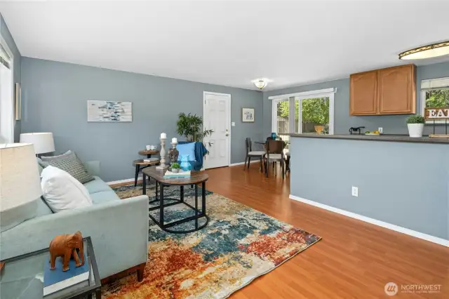 Living room looking into dining and kitchen area