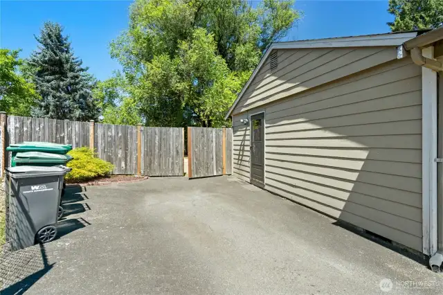 Driveway, showing side door to the home and rv parking to the back.