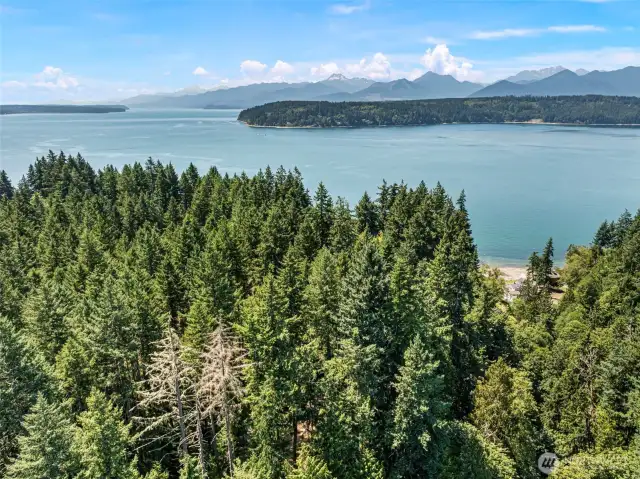 Drone above property showing the hood canal and olympic mountains