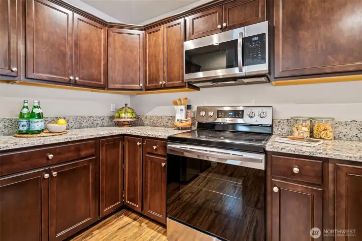 Stainless appliances and granite countertops.
