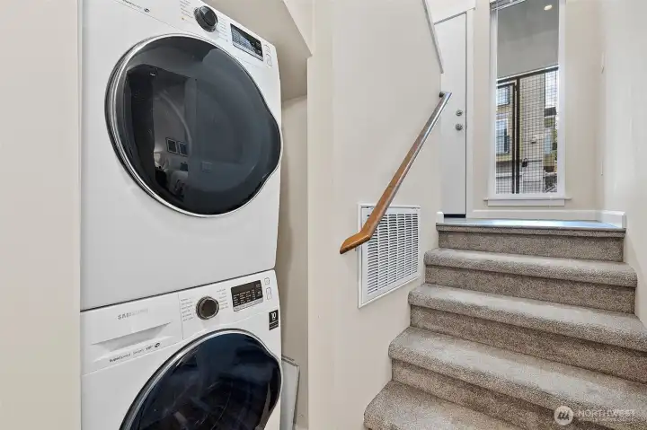 Laundry closet on lower level includes tankless hot water heater.
