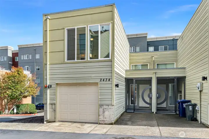 Secure entry and an attached one-car deep garage add convenience and peace of mind.