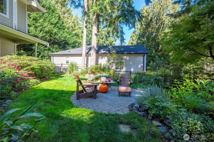 There is a small solar powered pond feature in the front yard surrounded by an herb garden offering oregano, thyme, rosemary & sage.