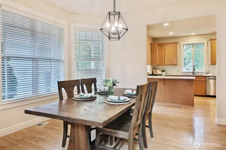Large dining area with bay windows