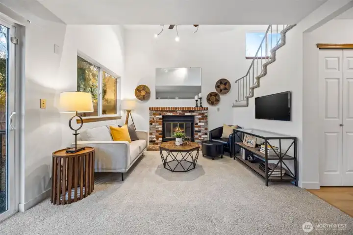 Vaulted ceiling and cozy wood burning fireplace.