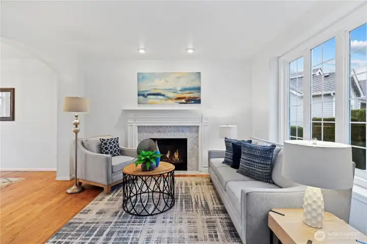 Welcome into our front living room w/ cozy fireplace