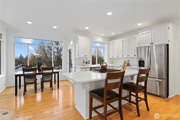 Not only a little island seating, you have a breakfast nook as well