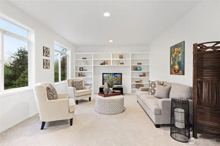 What a great, light-filled additional family room - or alternative living room for parents?