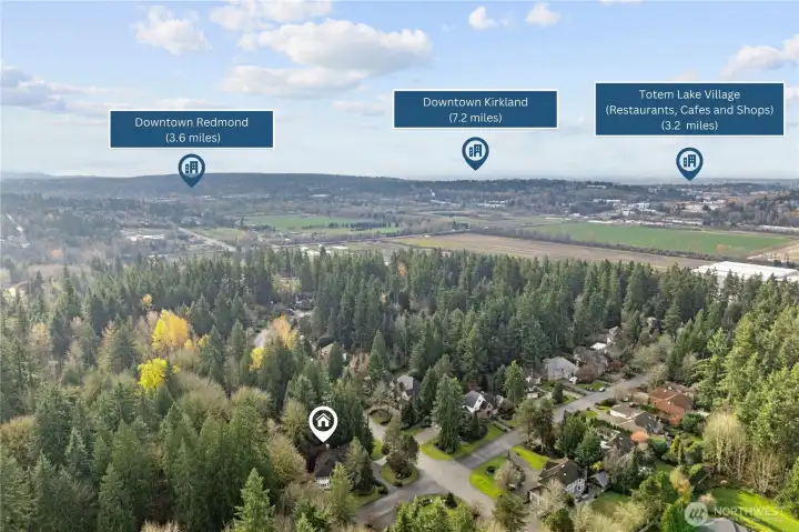 A north-facing perspective illustrating the home’s central location with easy access to Downtown Redmond, Downtown Kirkland, and Totem Lake Village, all while remaining tucked into a peaceful, forested neighborhood.