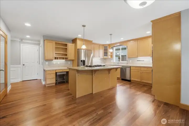 Another view of the spacious kitchen with the pantry door to the left.