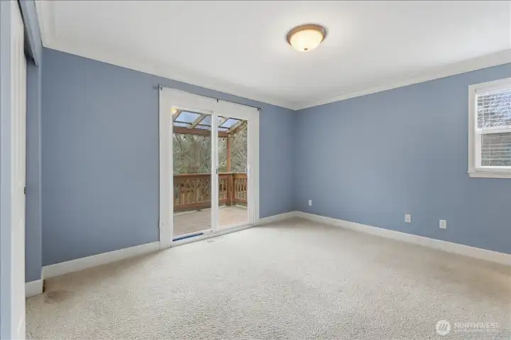 Main level MIL bedroom with outside access.