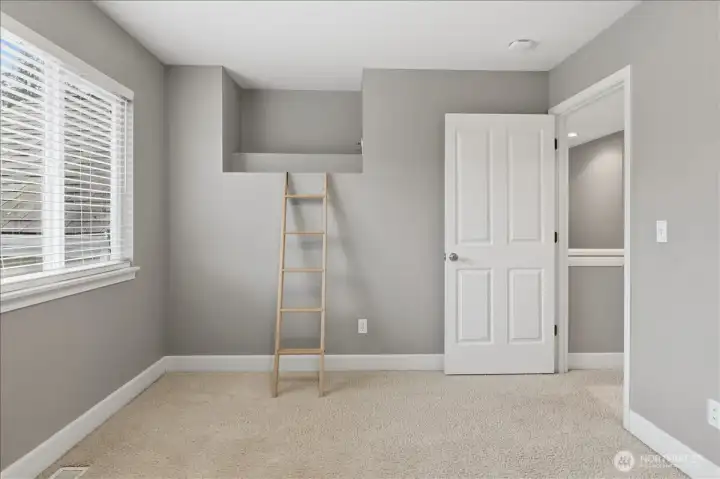 Fourth bedroom with a small lofted area.