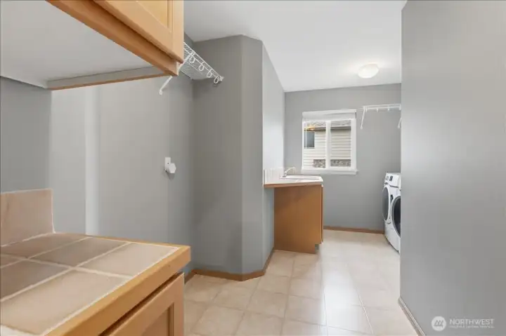 Spacious upstair laundry room - washer and dryer will convey.