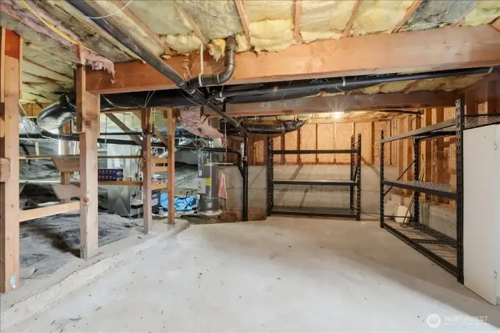 MORE storage in the walk-in crawl space with partial concrete flooring and shelving that will convey.