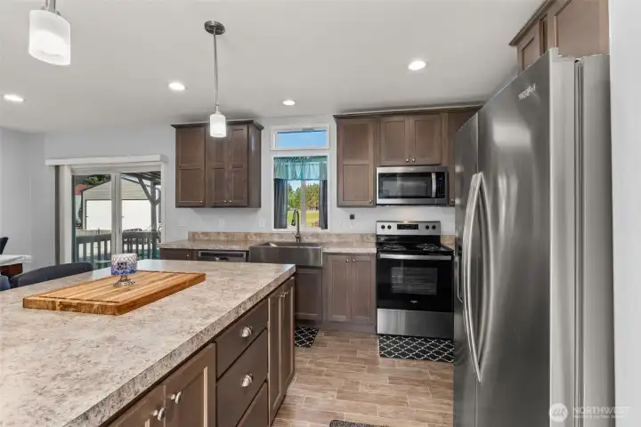 Kitchen with sliding door to covered deck.