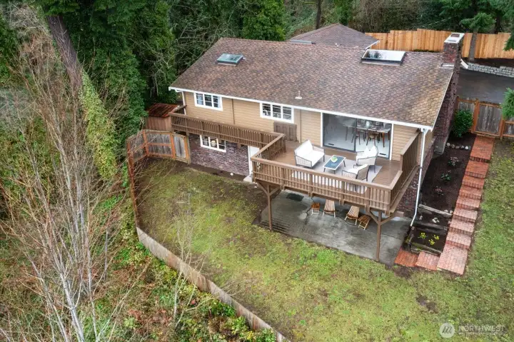 A feeing of privacy from this large, fenced yard, on a gentle slope with space to create an urban garden offering year-round outdoor enjoyment