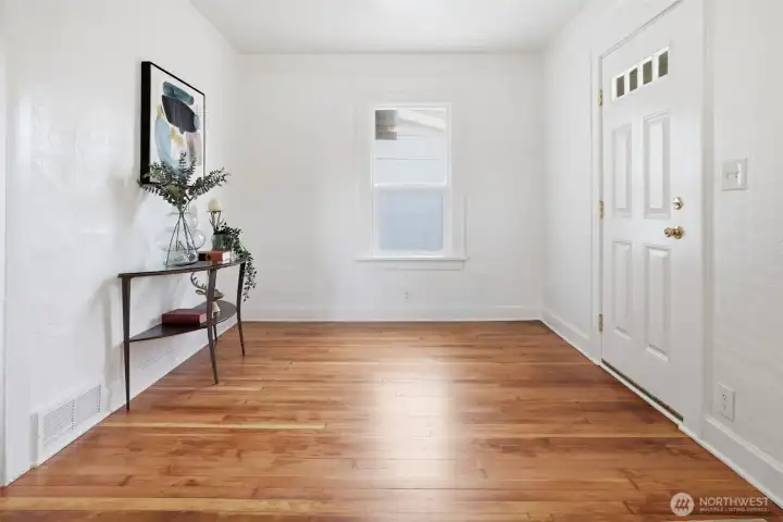 Bright sun-filled entry sets the tone for the cheerful attitude throughout all the spaces this well-maintained Seattle bungalow is so proud of. Bright sun-filled entry sets the tone for the cheerful attitude throughout all the spaces this well-maintained Seattle bungalow is so proud of.