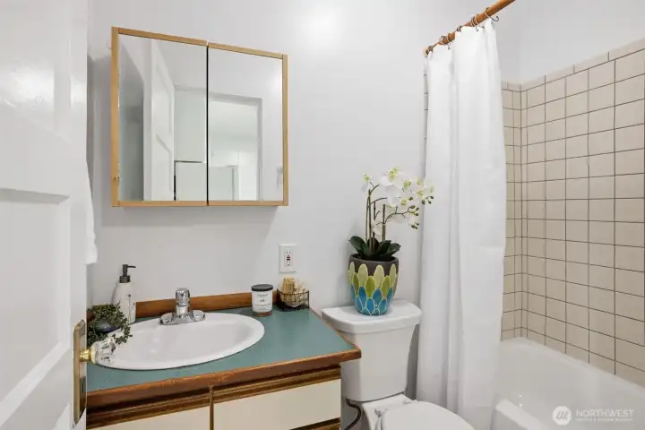 Classic tile finishes and freshly re-surfaced tub! Classic tile finishes and freshly re-surfaced tub!