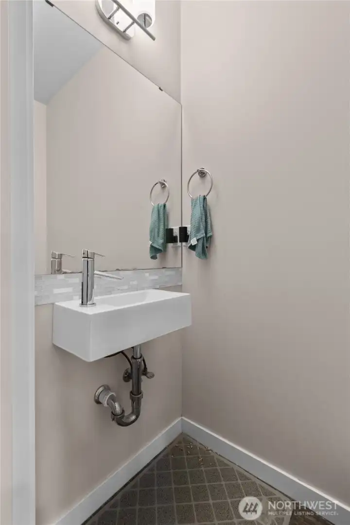 Half bath is just off the great room near the garage