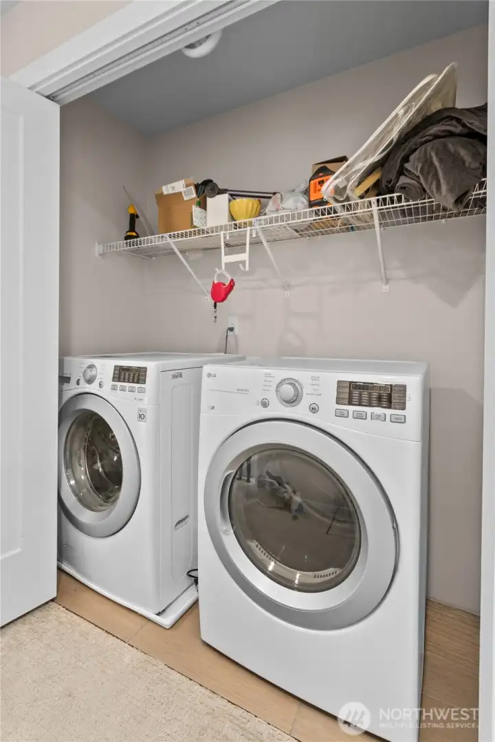 Laundry space, adjacent to primary, includes LG appliances