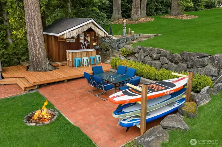 Tiki bar, lake front patio, paddle board storage and fire pit
