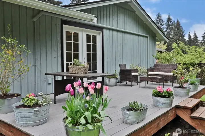 back deck for enjoying outdoor dining, relaxing and listening to the birdsong from the adjoining forest