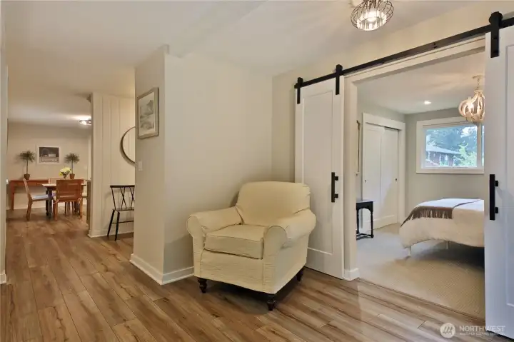 living space connects to the primary with contemporary sliding doors