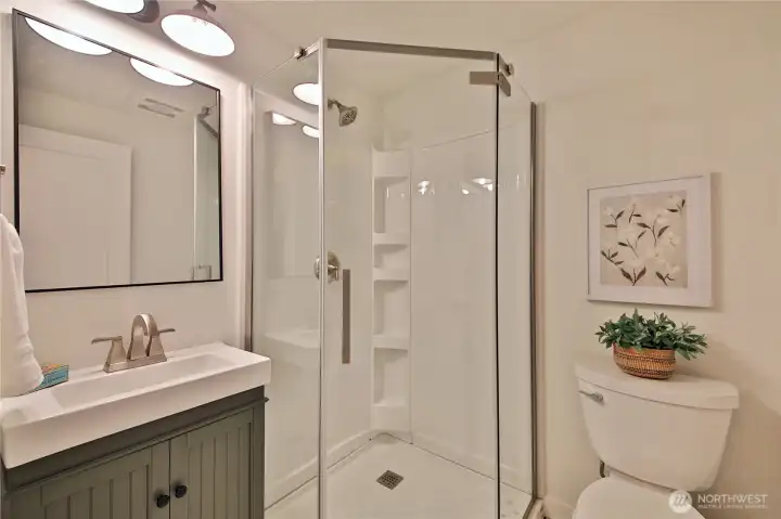 2nd bath. compact yet has everything you need, with lovely tile floor
