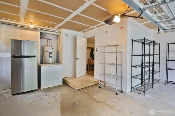 Garage with room for storage, appliances convey.