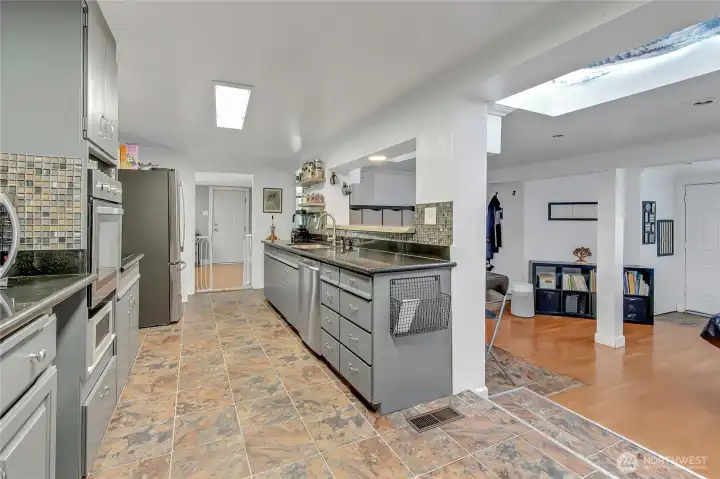 Kitchen area looking towards the dining and living room with your bonus area to the right.
