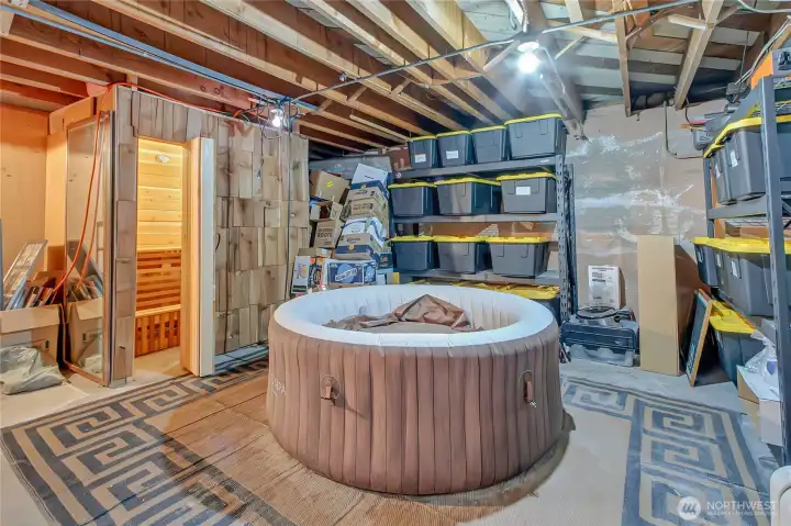 Partially finished basement. Currently has a portable hot tub and a sauna. Not to mention all the additional storage!