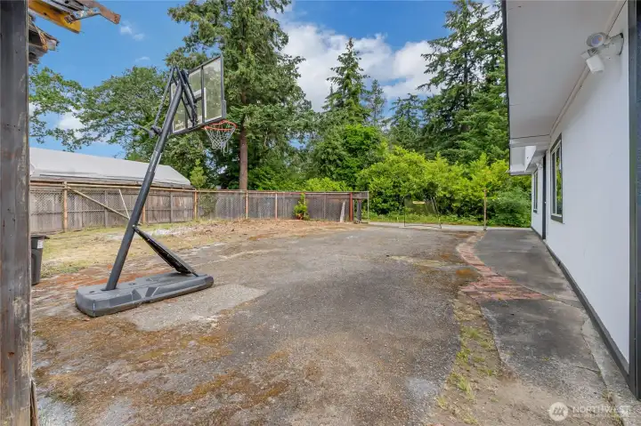 Currently paved in the back for some good sports or even parking.